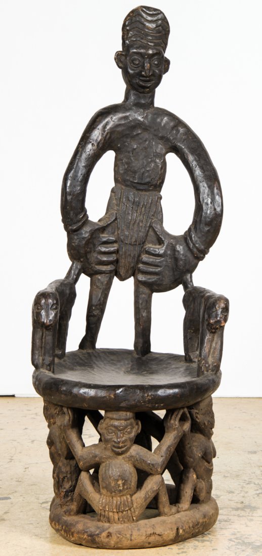 African Carved Throne Chair: African Carved Throne Chair. Cameroon. Carved wood. Size: 50" x 19" x 18.5" (127 x 48 x 47 cm).