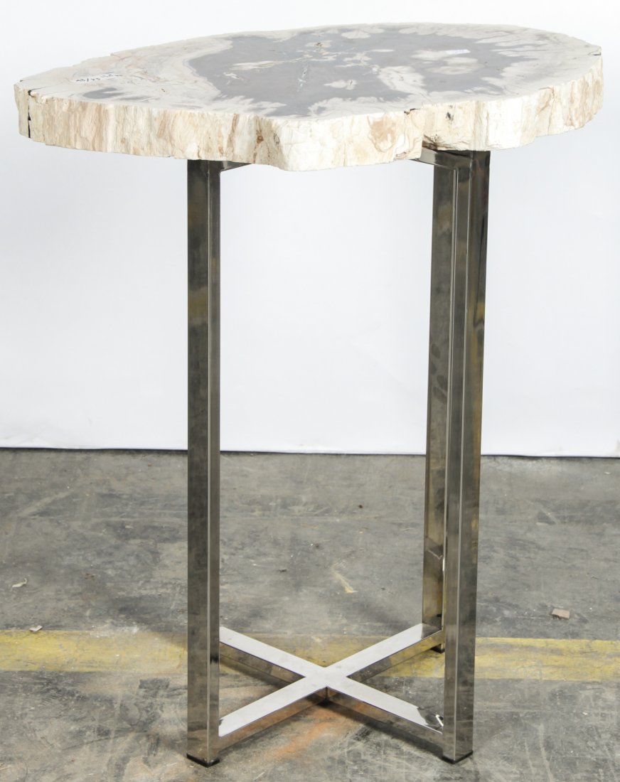 20 Million Year Petrified Wood: 20 Million Year Petrified Wood Table, Indonesia. Size: 26.25" x 22" x 16.5" (67 x 56 x 42 cm).