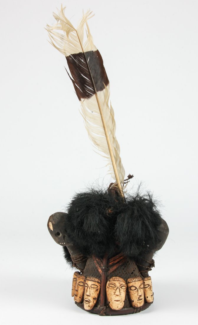 Konyak Headhunter Hat: Konyak Headhunter Hat - an old, finely woven cane and bamboo Konyak Naga warrior's hat, with an odd pair of crudely carved wooden attachments, six unusual carved bone faces of unknown origin, and a cl