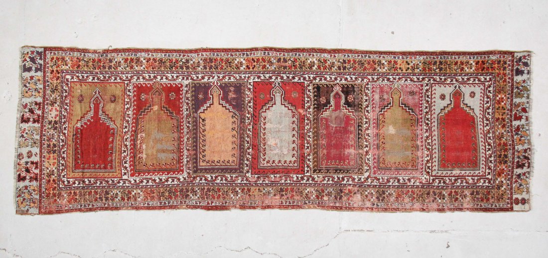 Antique Kirshehir Saf Prayer Rug: 3'8" x 11'5": Antique Kirshehir Saf Prayer Rug: 3'8" x 11'5" (112 x 348 cm), mid/late 19th c, central Turkey; horizontal row of 7 mihrabs (prayer arches).