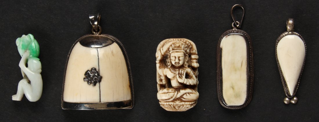 Asian Suite of Antique Carved Artifacts: Asian Suite of Antique Carved Artifacts. Consisting of 3 bezel set pendants, a Buddhist toggle, and a white jade figural monkey. Largest Size: 1.5" x 1.25" x 1" (4 x 3 x 3 cm). BIDDERS, PLEASE NOTE: I