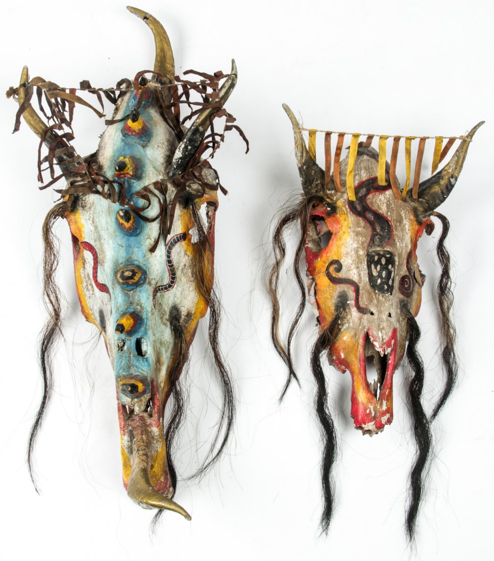 2 Mexican Skeletal Bone Masks: 2 Mexican Skeletal Bone Masks. Made of horse and cow skulls and embellished with paint, ribbons, hair and horns. Largest Size: 30" x 12" x 9" (76 x 30 x 23 cm). Provenance: Bob Brand and Liz Werthan,