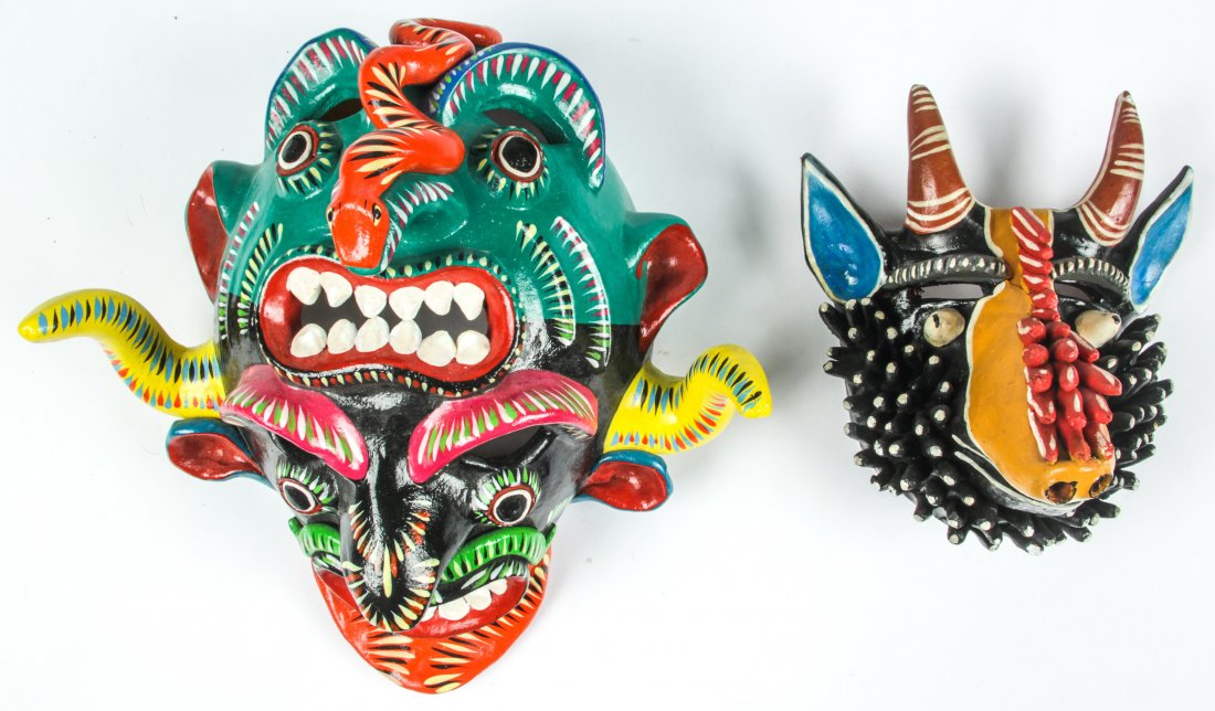 2 Vintage Mexican Earthenware Masks: 2 Vintage Mexican Earthenware Masks. Consisting of an Ocumicho Diablo and a Tonala Creature. Painted terra cotta. Largest Size: 13" x 13" x 9" (33 x 33 x 23 cm). Provenance: Bob Brand and Liz Werthan,