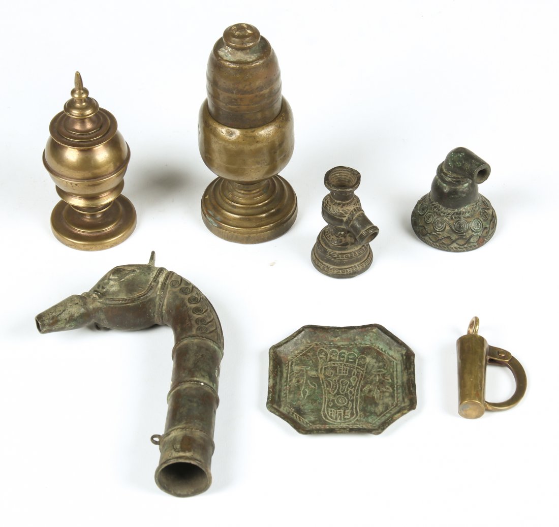 Collection of 7 Brass/Bronze Artifacts: Burmese cain handle, lighters, tobacco pipes, ceremonial plate and lock, circa 1850-1950, rare domestic items, great patina. Total weight: 1140 g. Ranging in size from 5.5"H, 14cm to 2.25"H, 6cm. Prov