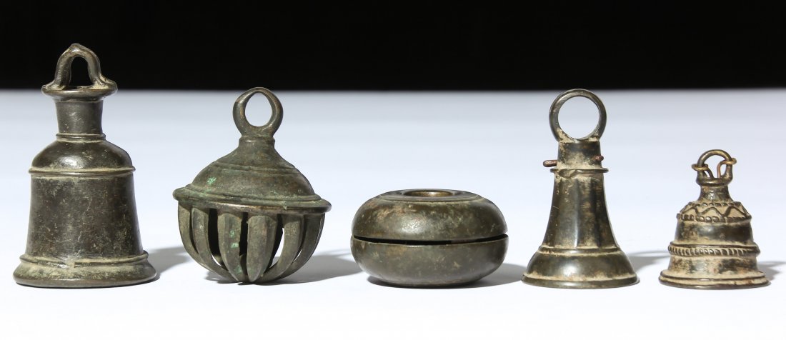 Five 19th C. Bronze Bells: Three Rare Buddhist Temple Bells, plus one Cow Bell and one ceremonial bell, 19th c, rich patina. Total weight: 600 g. Ranging in size from 3.5"H, 9cm to 1.25"H, 3cm. Provenance: Matthew Friedman Coll
