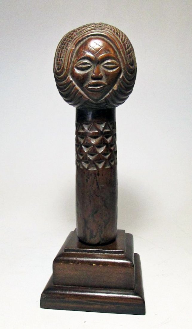 Rare Old Ovimbundu Staff, Angola: Ovimbundu staff or scepter, Angola, Africa. Carved wood with ornate tribal motifs incised into the wood with a most unusual female head and elaborate coiffure, rich patina. Size: 10" (25 cm) tall.