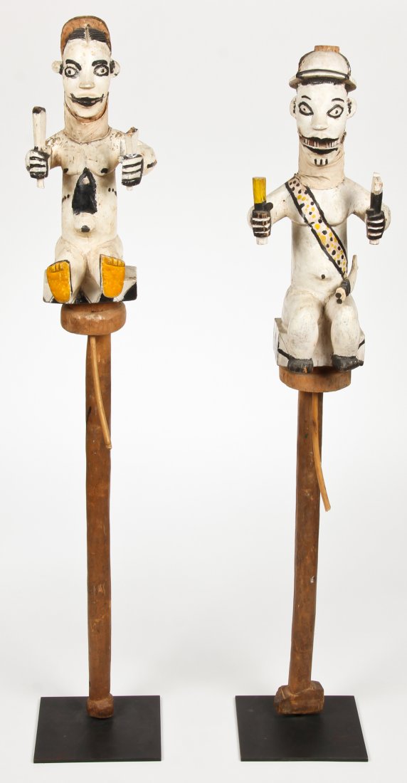 2 Ibibio Marionettes: 2 Ibibio Marionettes. Nigeria. Articulated jaws. Carved and painted wood. Largest Size: 46" x 8" x 8", 117 x 20 x 20 cm (base).