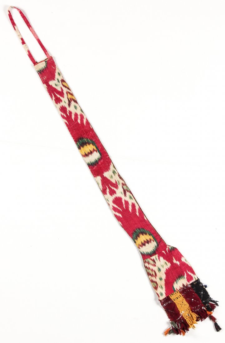 19th C. Woman's Hair Covering, Uzbekistan: 19th C. Woman's Hair Covering, Uzbekistan, silk couched stitch (basma) embroidery covering entire cotton ground cloth; with c. 1860 ikat lining; used to cover a long braid. 7" x 48" (18 x 117 cm).