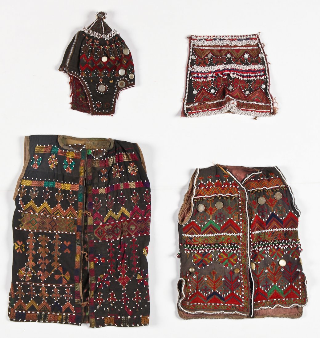 4 Old Nuristani Textiles: Vests/Hats: 4 Old Nuristani Textiles: Vests/Hats. Largest Size: 13" x 19" (33 x 48 cm).