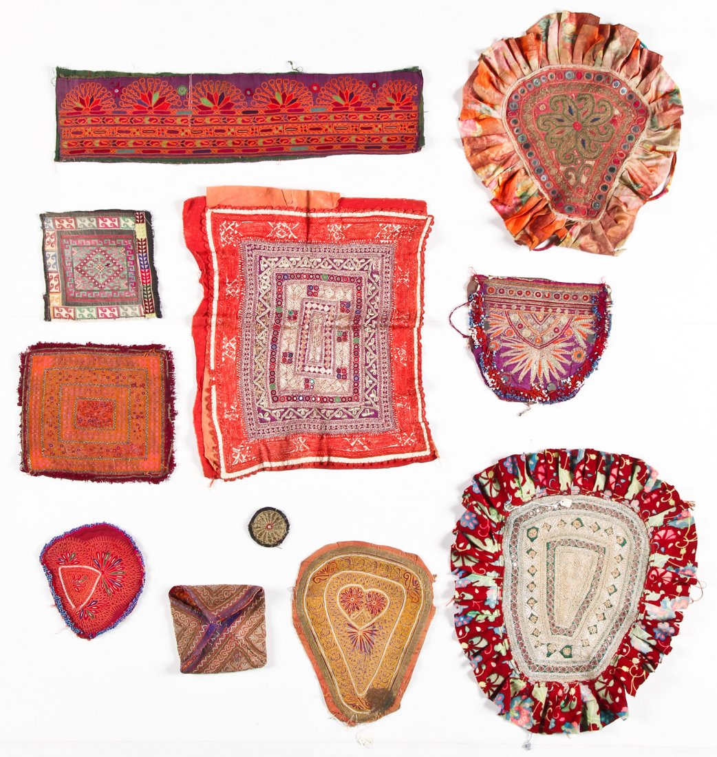 Collection of 11 Old Central Asian Embroidered Textiles: Collection of 11 Old Tribal Embroidered Textiles. Largest Size: 20" x 16" (51 x 76 cm).