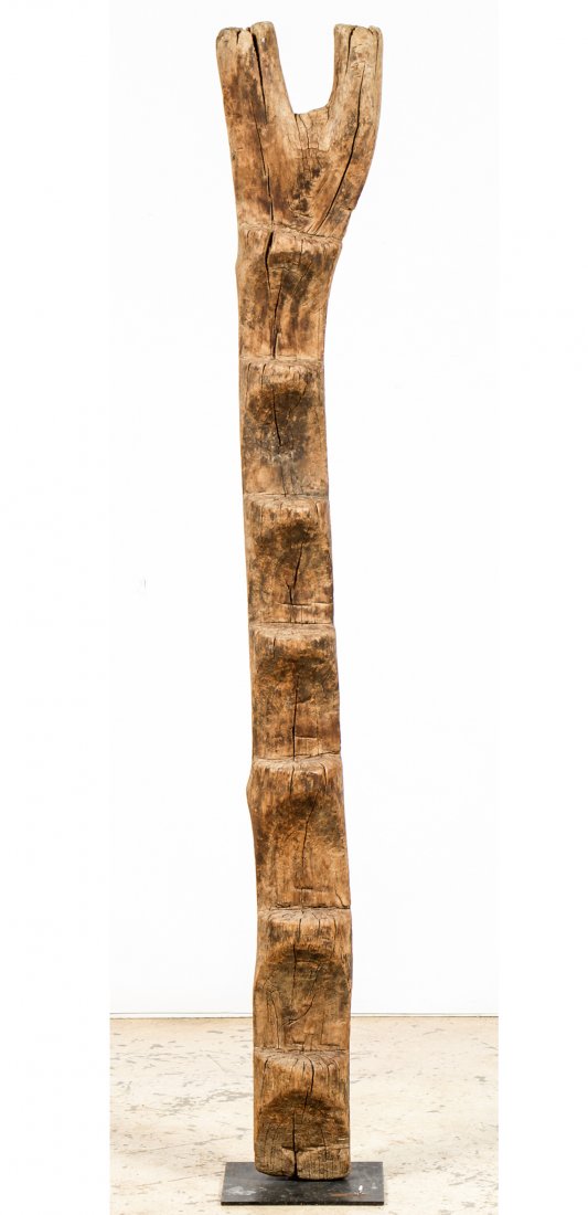 Dogon Ladder: Dogon Ladder. Mali, Africa. Hewn wood. Size: 74.5" x 10.5" x 5.5", 189 x 27 x 14 cm; 10" x 10.5", 25 x 27 cm (base).