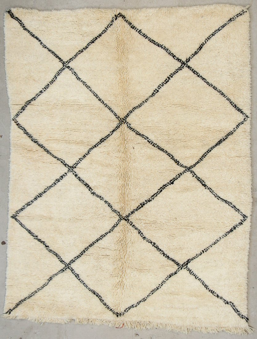 Vintage Moroccan Beni Ouraine Rug: 6' x 7'10" (184 x: Vintage Moroccan Beni Ouraine Rug. Hand-knotted with undyed natural shades of hand-spun sheep's wool; thick, shaggy, lustrous pile. Recently professionally cleaned. Size: 6' x 7'10" (184 x 240 cm). We