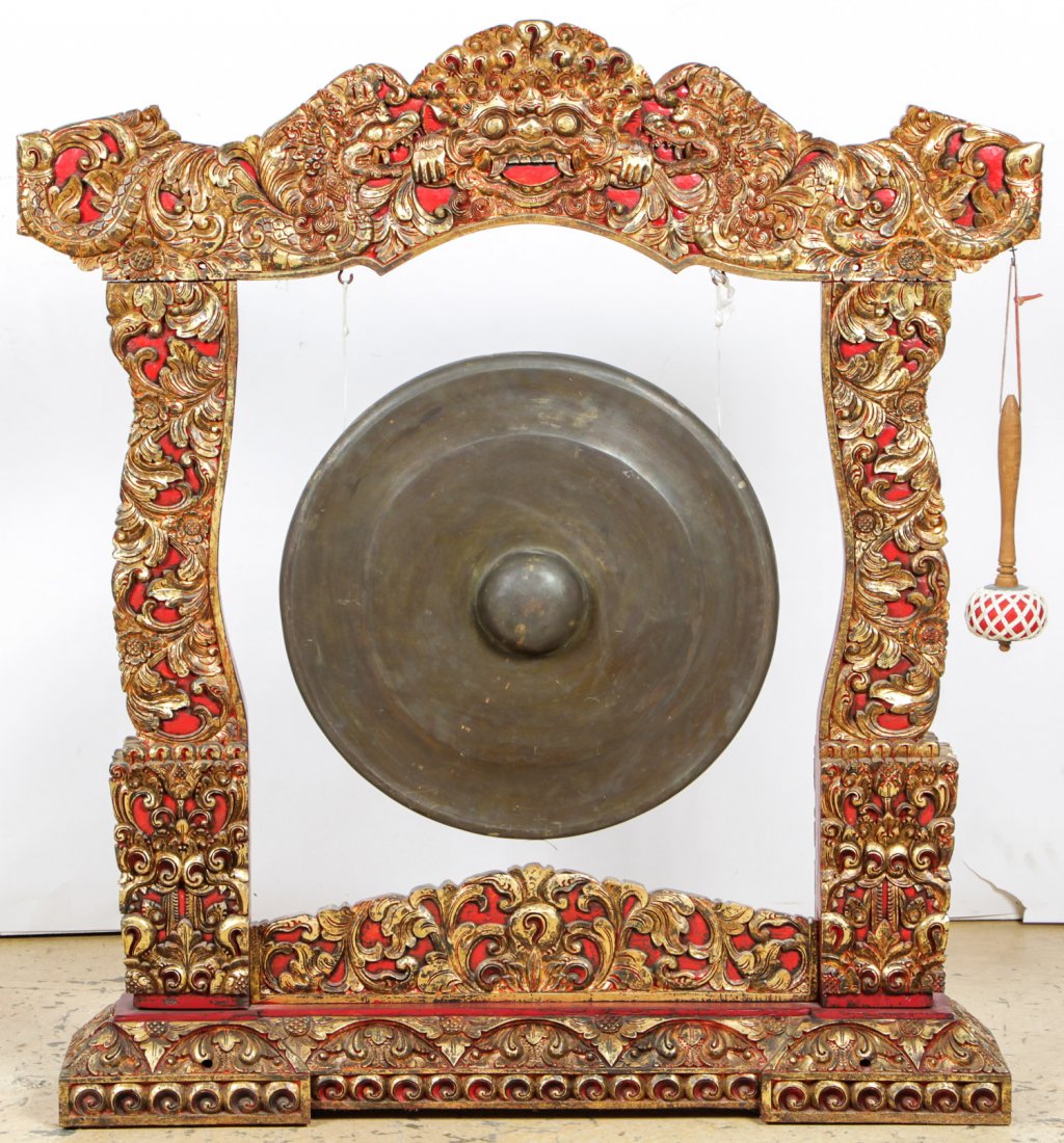 Vintage Balinese Gong on Intricately Carved Wood Stand: Vintage Balinese Gong on Intricately Carved Wood Stand, lacquer, polychrome decoration. Size: 49" x 45" x 7.5" (124 x 114 x 19 cm).