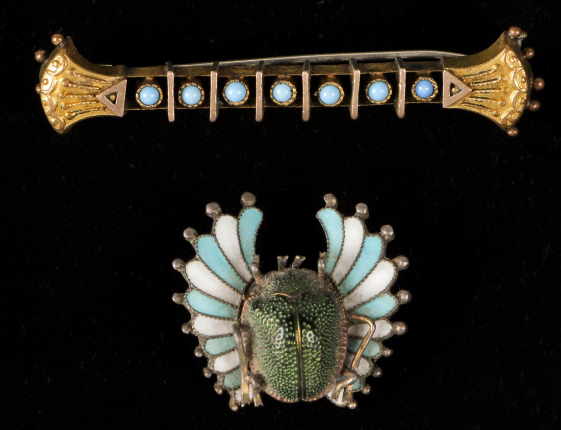 2 Art Deco Brooches: 2 Art Deco Brooches, enamel decorated silver, including an Egyptian revival Scarab Beetle Brooch. Largest Size: 2.25"L (6 cm).