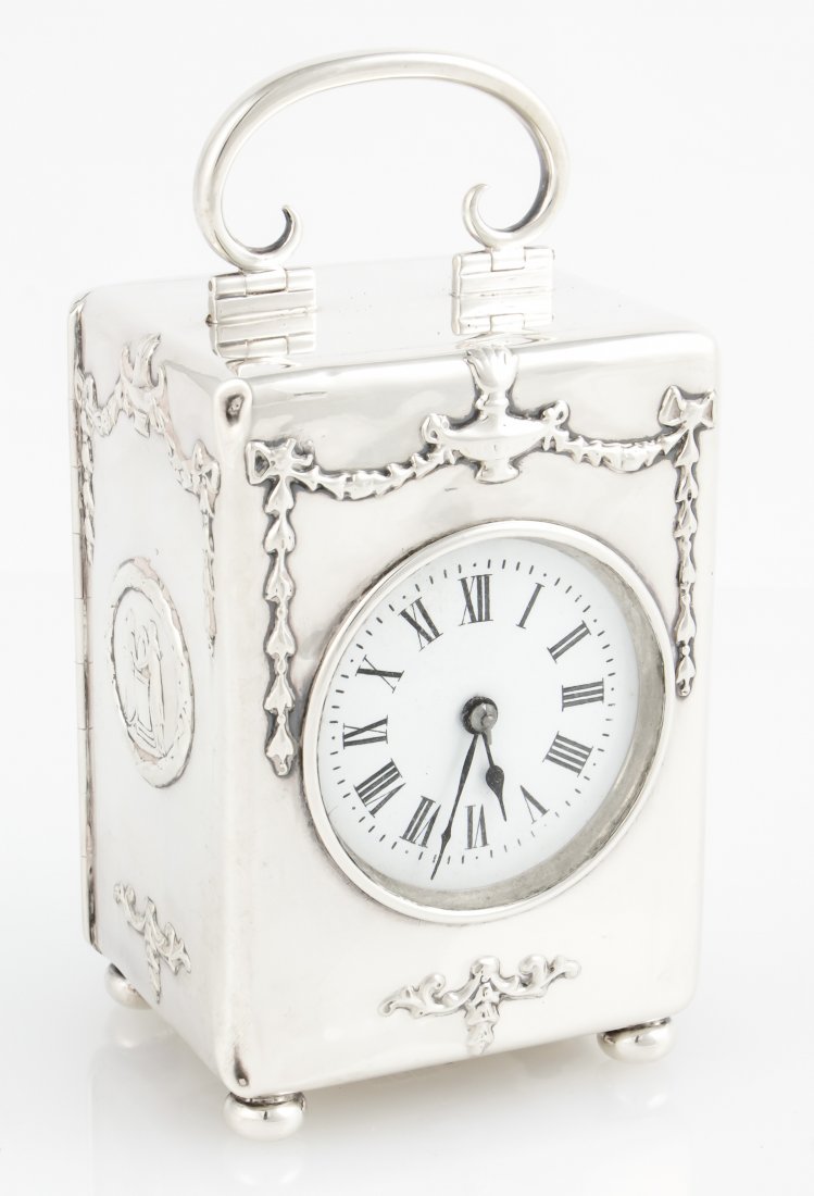 Antique English Silver Carriage Clock: Antique English Silver Carriage Clock, in hallmarked Sterling case by William Comyns & Sons. Size: 6''H x 3''W x 2.5''D, 15 x 8 x 6 cm. Provenance: Natasha Ogden Tolstoy; Private Philadelphia, PA Esta