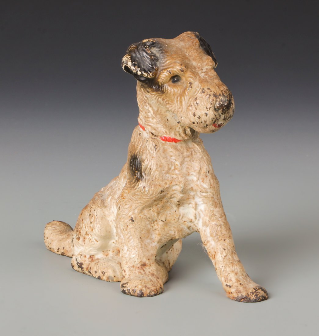 Cast Iron Fox Terrier Doorstop: Cast Iron Fox Terrier Doorstop. Possibly Hubley. Size: 4.75''H x 2.25''W x 5.75''D, 12 x 6 x 15 cm.