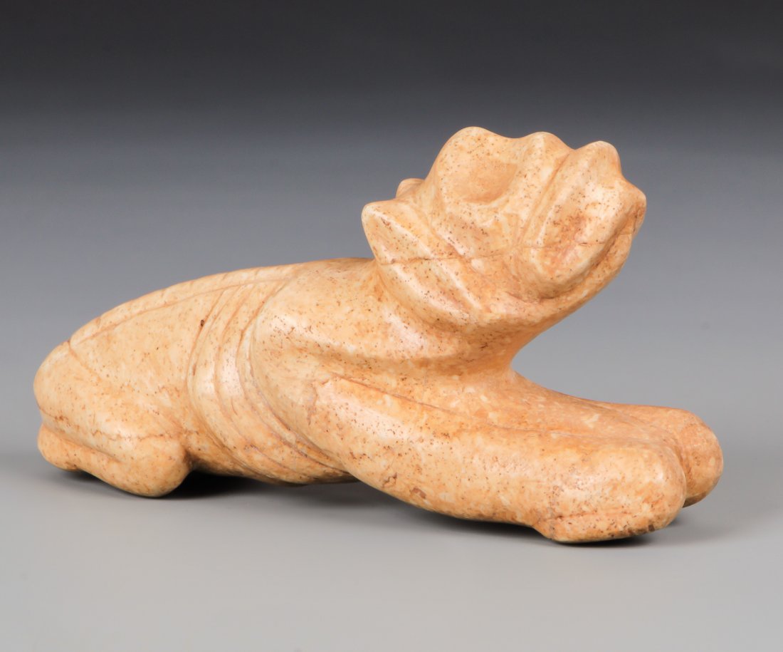 Taino Reclining Dog Effigy (1000-1500 CE): Taino Reclining Dog Effigy (1000-1500 CE) Made of jasper-like stone with nice detail. Head up in reverent position. Size: 2" x 1.25" x 3.75" (5 x 3 x 10 cm).