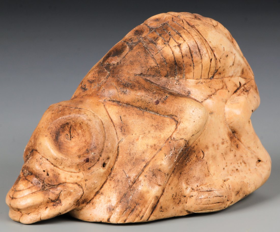 Taino Jasper Anthropic Shamanic Figure (1000-1500 CE): Taino Jasper Anthropic Shamanic Figure (1000-1500 CE) with animal-like head. Articulated vertebrae and ribs emphasize fasting. Full interlocking bird-head base design. Size: 2.5" x 2" x 3.75" (6 x 5 x