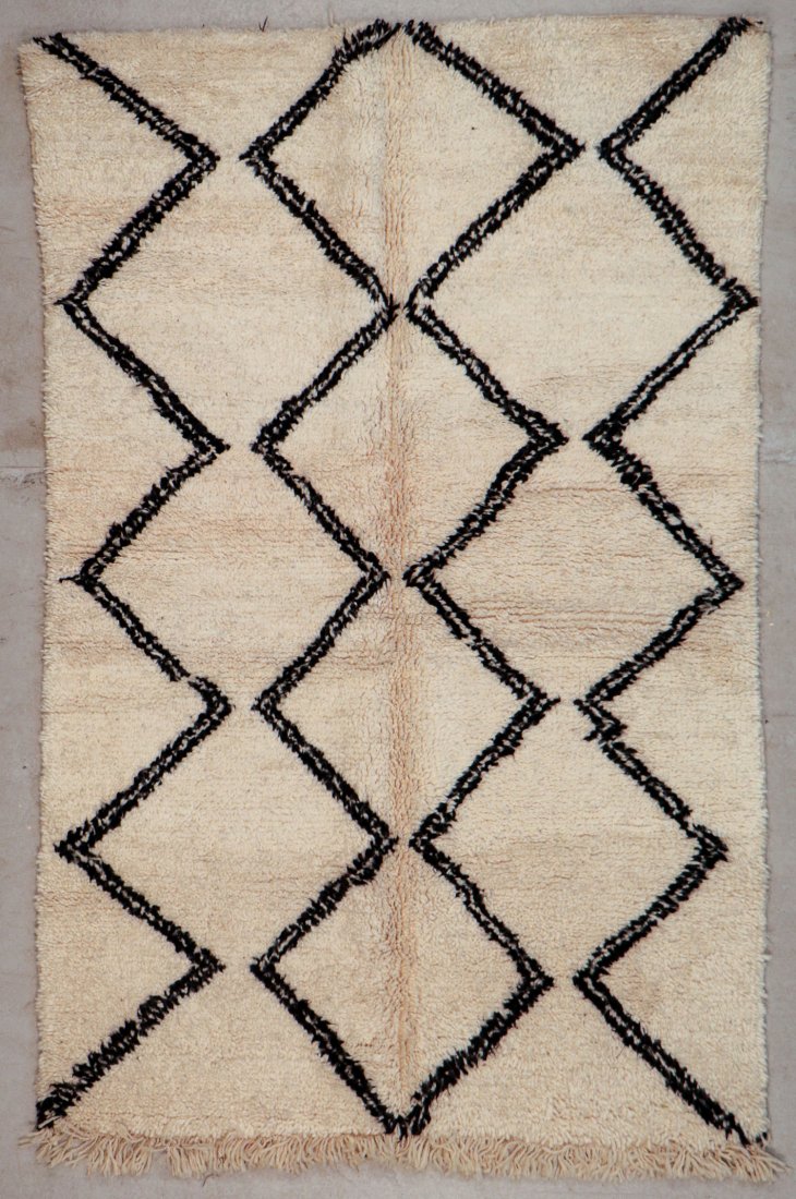 Vintage Beni Ourain Rug: 4'5" x 6'11" (135 x 210 cm): Vintage Beni Ourain Rug, Morocco: 4'5" x 6'11" (135 x 210 cm). Hand-knotted with undyed natural shades of hand-spun sheep's wool; thick, shaggy, lustrous pile. Recently professionally cleaned. Prov: p