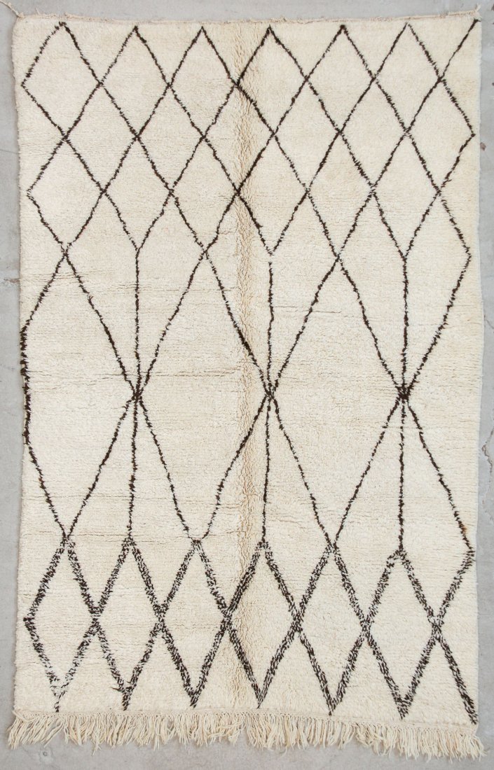 Vintage Beni Ourain Rug: 5'6" x 8'2" (167 x 250 cm): Vintage Beni Ourain Rug, Morocco: 5'6" x 8'2" (167 x 250 cm). Hand-knotted with undyed natural shades of hand-spun sheep's wool; thick, shaggy, lustrous pile. Recently professionally cleaned. Prov: pr