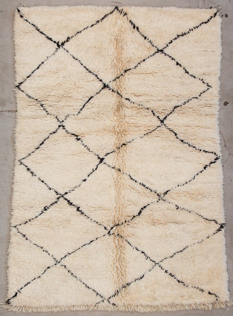 Vintage Beni Ourain Rug: 5'1" x 7'5" (156 x 225 cm): Vintage Beni Ourain Rug, Morocco: 5'1" x 7'5" (156 x 225 cm). Hand-knotted with undyed natural shades of hand-spun sheep's wool; thick, shaggy, lustrous pile. Recently professionally cleaned. Prov: pr