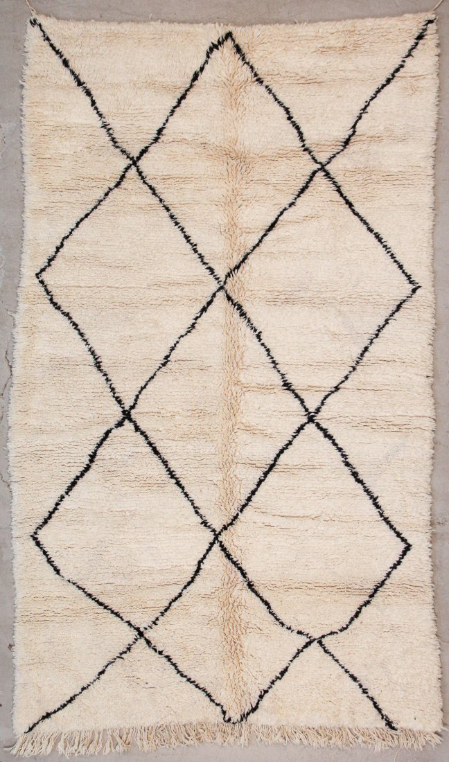 Vintage Beni Ourain Rug: 5'6" x 9'2" (167 x 280 cm): Vintage Beni Ourain Rug, Morocco: 5'6" x 9'2" (167 x 280 cm). Hand-knotted with undyed natural shades of hand-spun sheep's wool; thick, shaggy, lustrous pile. Recently professionally cleaned. Prov: pr