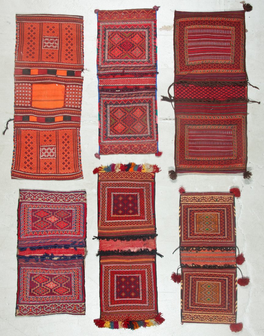 6 Semi-Antique Central Asian Saddlebags: 6 Semi-Antique Central Asian Saddlebags. Largest size: 1'10'' x 4'4'' (56 x 132 cm). Provenance: Estate of Professor Louis Flam.