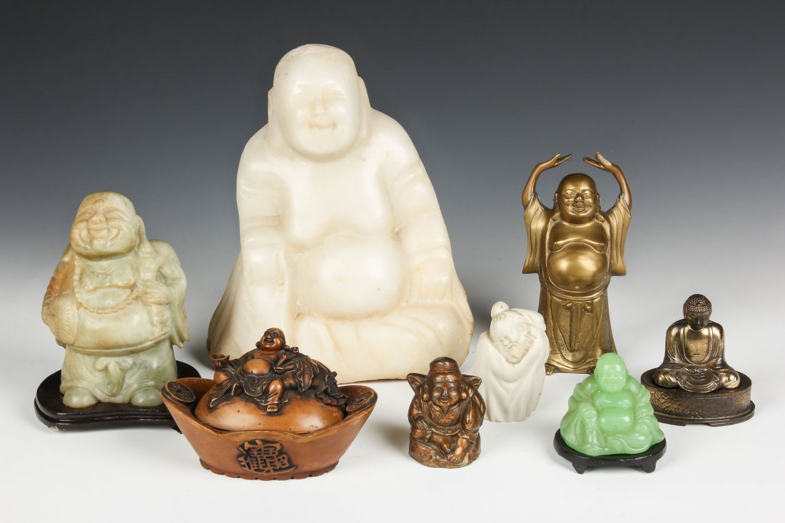 Group of 8 Buddha Sculptures: Group of 8 Buddha Sculptures, various origins, ages and materials. The largest a carved stone Buddha. Largest Size: 9.75" x 8" x 4" (25 x 20 x 10 cm).