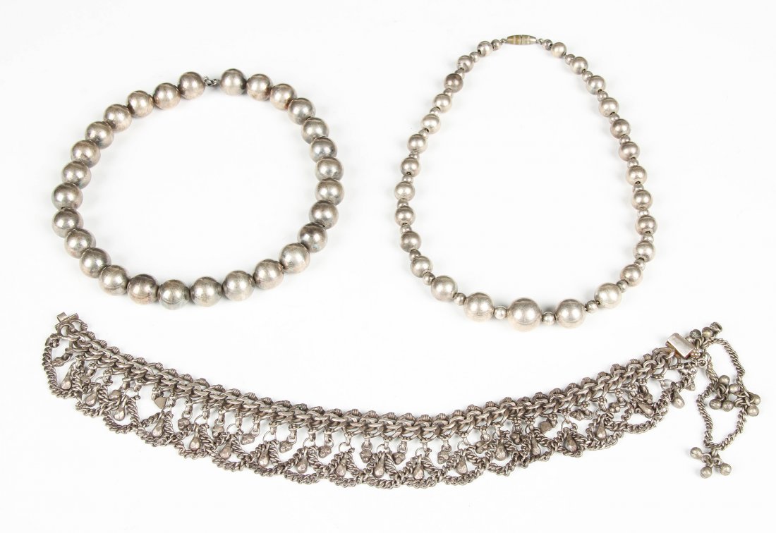 3 Silver Necklaces: 3 Silver Necklaces. 2 strands of hollow beads and a tribal choker. Unmarked. Longest: 17.5'' (44 cm). Estate of Edward Soleimani, Englewood, NJ.