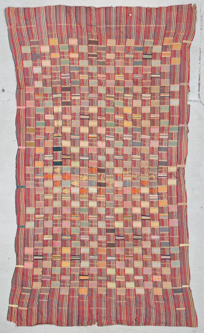 Semi-Antique African Ewe Cloth: Semi-Antique African Ewe Cloth; cotton, narrow strip loom panels sewn together. Sporadic points where stitching between panels is loose/absent; stains. Size: 66'' x 110'' (168 x 279 cm).