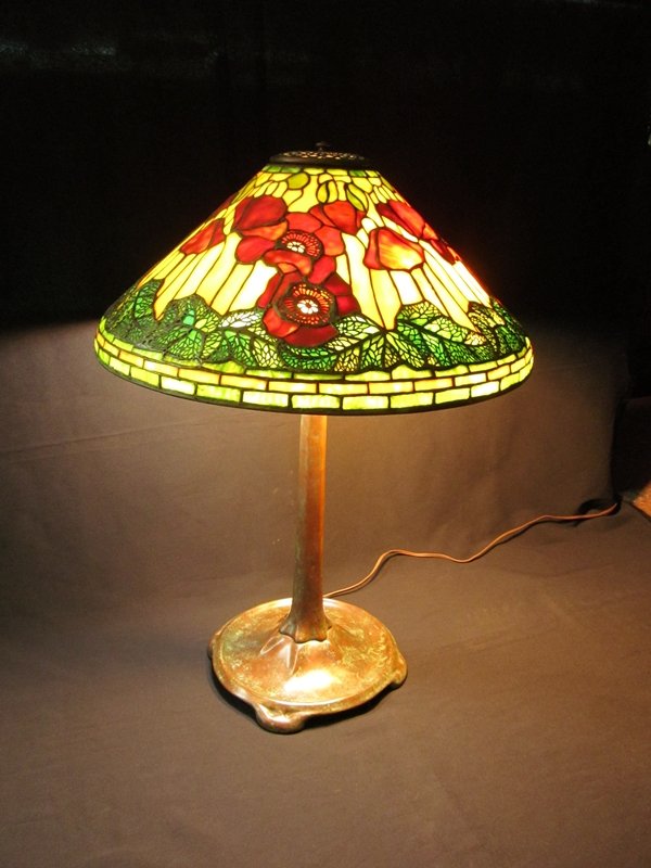 Tiffany Studios New York Poppy Leaded Glass Lamp: A 'POPPY' LEADED GLASS AND BRONZE TABLE LAMP, CIRCA 1910 RARE AND IMPORTANT SIGNED TIFFANY STUDIOS NEW YORK RED POPPY TABLE LAMP. This extraordinary example of the mastery of Tiffany Studios is a supe