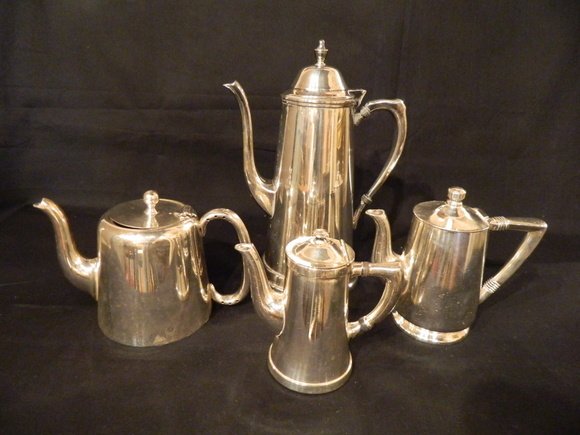 Group of Four Tea and Coffee Pots. Hallmarks: "B: Group of Four Tea and Coffee Pots. Hallmarks: "Benedict Destructo Made in USA", "Reed & Barton Silver Soldered", "E.P.N.S. Hard Soldered Blank by Henry Jenkins, Birmingham", "5th Ave. Silver Co. Silve