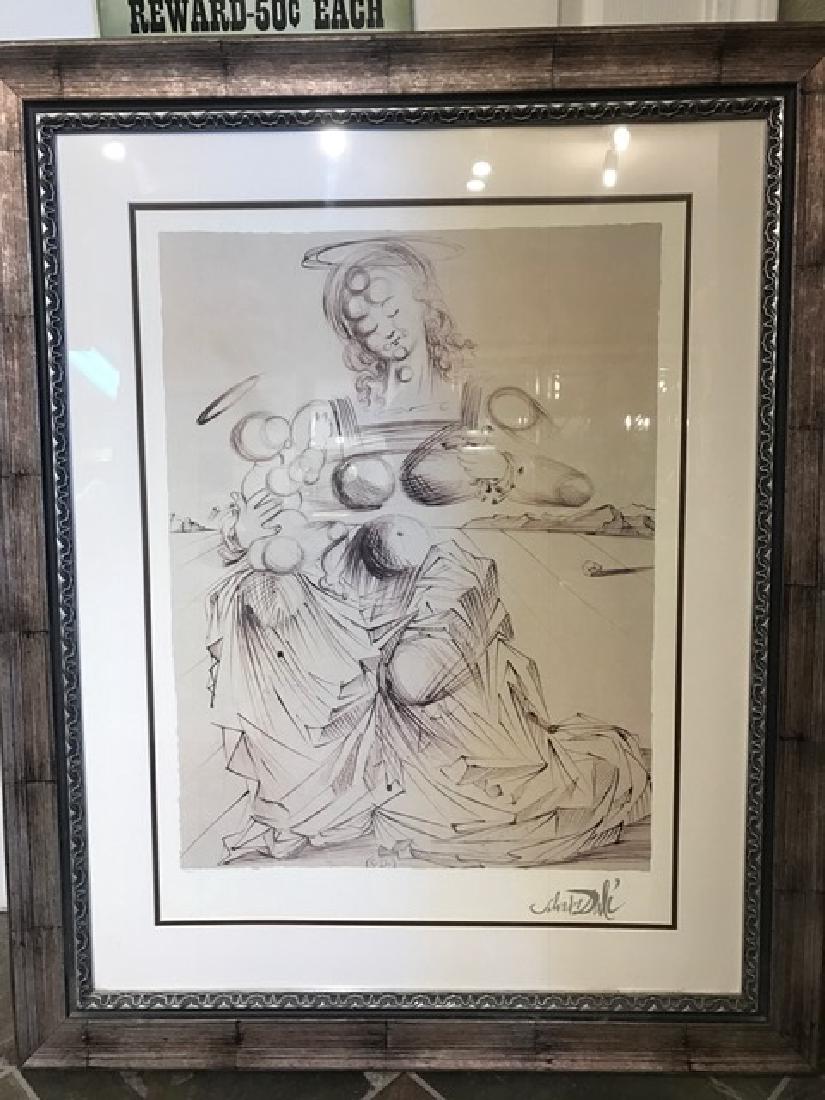"Exploding Madonna" Limited Ed. Print by Salvador Dali: "Exploding Madonna" limited edition print numbered 27/500. Certificate of Authenticity on the back. Framed in wooden frame. From a private collection. Measures approx. 43" H x 34" W