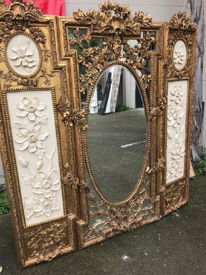 Gilded Wood and Mirrored 3 Panel Screen: Beautiful three panel screen with mirror in the middle panel centered with an oval mirror. Great details throughout with a floral design. Measures approx. 72" H x 66"W