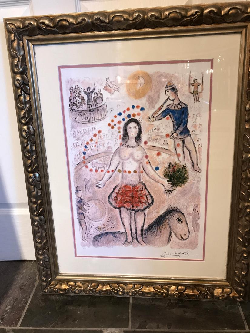 "La Danseuse Au Flustite" by Marc Chagall: Framed print titled, "La Danseuse Au Flustite" by Marc Chagall. A limited edition numbered 4 of 99 with certificate of authenticity on back. Framed in a beautiful detailed frame. From a private collec