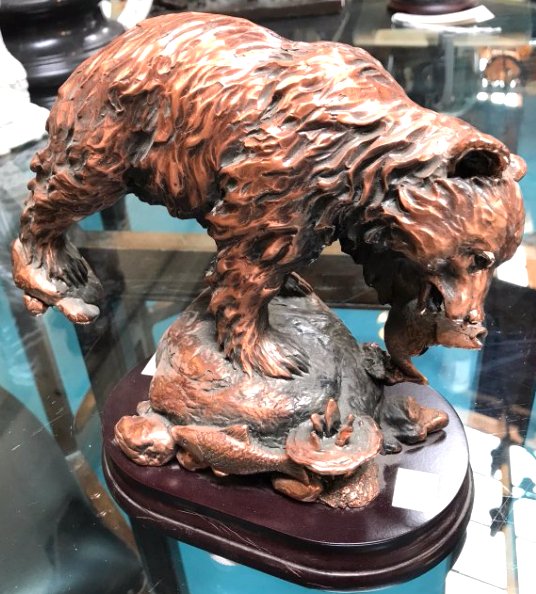 Bronze Statue of Grizzly Bear Catching Fish: Very detailed bronze statue of a grizzly bear catching a fish. Mounted on wood stand. Measures approx. 8.5"H x 10"W x 4.5"D