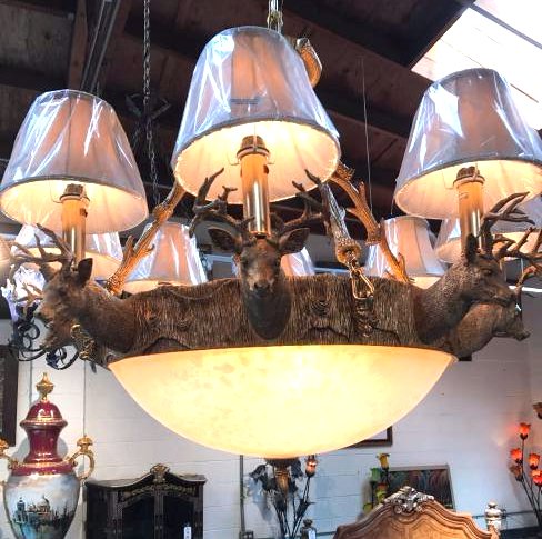 Bronze and Frosted Glass Deer Chandelier: Unique frosted glass and gilded bronze chandelier depicting a deer theme with eight bucks heads and lights going around the center. Great details. Measures approx. 36Wx34"H