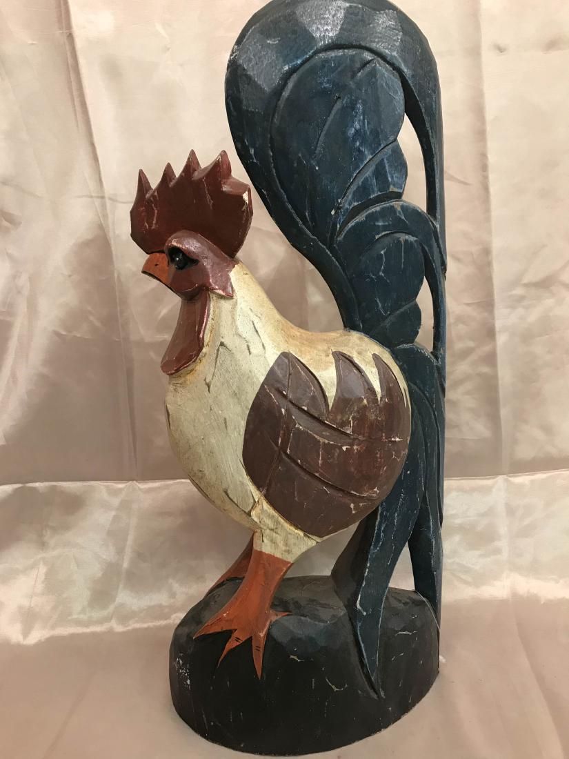 Vintage Hand-Carved Wooden Rooster Statue: Hand-carved vintage wooden rooster statue with brown, red, and yellow. Measures approx. 19.5"H x 8.5"W x 3"D.
