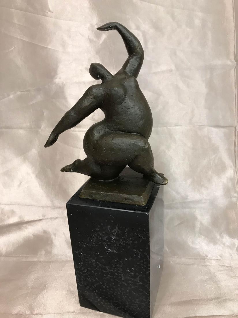 Abstract Bronze Statue of Curvy Woman by Milo: Abstract bronze statue of a curvy woman dancing mounted on a smooth, solid black onyx base. Signed, "Milo." In excellent condition. From a private estate. Measures approx. 11"H x 4.25"W x 3.25"D.