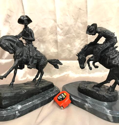 Bronze "Cowboy" and "Rattlesnake" Statues by Remington: Two bronze statues by Frederic Remington. One titled, "Cowboy" and one titled "Rattlesnake." Both mounted on a smooth solid marble base. "Cowboy" measures approx. 14"H x 16"W x 8"D and "Rattlesnake" m