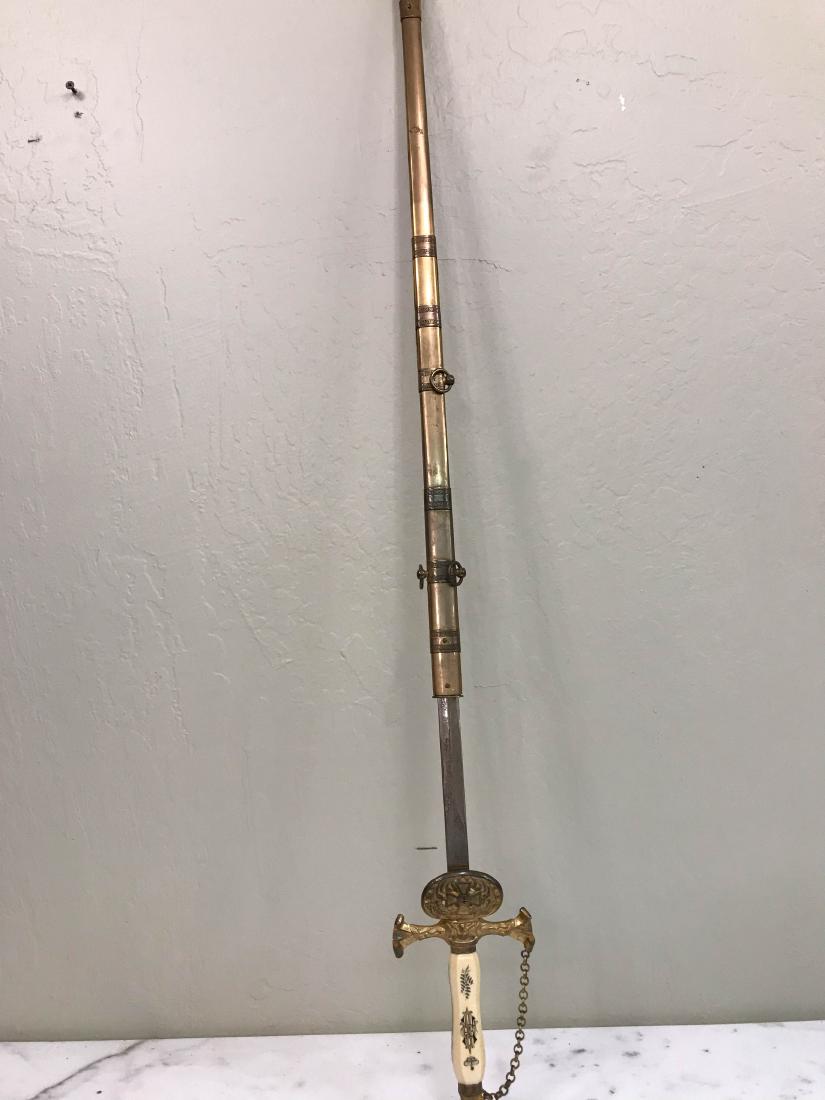 Old Sword with Etching and Bone Handle: Magnificent old sword with exceptional details including etching on blade and a bone handle. Has some normal wear, but overall in good condition. Measures approx. 38"L x 4.5"W.