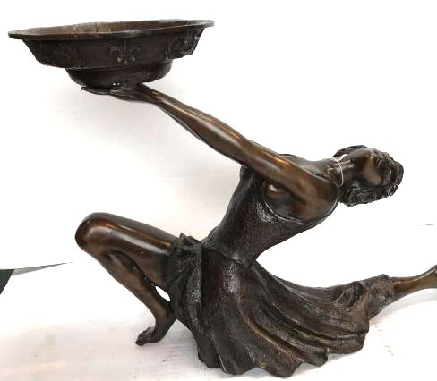 Art Deco Bronze Statue of Woman Holding Tray: Art deco bronze statue of a woman in a dress offering a tray. Has excellent details. From a private collection. Measures approx. 16.5"H x 22"W x 7"D.