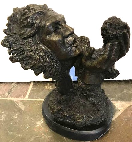 Bronze Statue of Indian Worshipping Fire: Unique and very detailed bronze statue depicting an Indian holding a molten rock In excellent condition. Measures approx. 10"H x 7"W x 5"D.