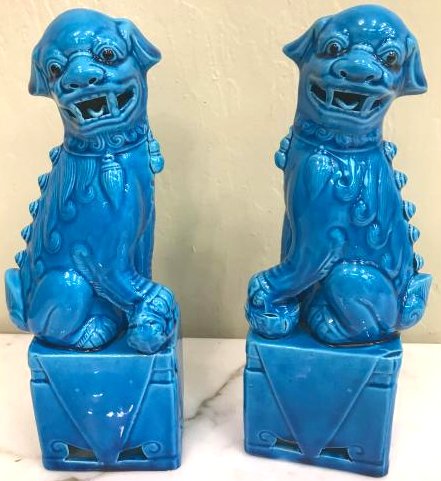 Pair of Porcelain Chinese Turquoise Foo Dogs: Pair of Chinese porcelain Foo dogs with turquiose underglaze. In good condition. Measures approx. 10"H x 4"W x 2.5"D.