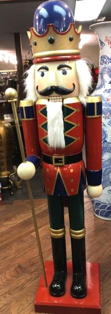 Large Wooden Nutcracker Holding Scepter 74"H: Large wooden decorative nutcracker holding a scepter with realistic hair and beard and a detailed mustache. Nutcracker/mouth moves. There is some wear in a few places, but overall in good condition. M