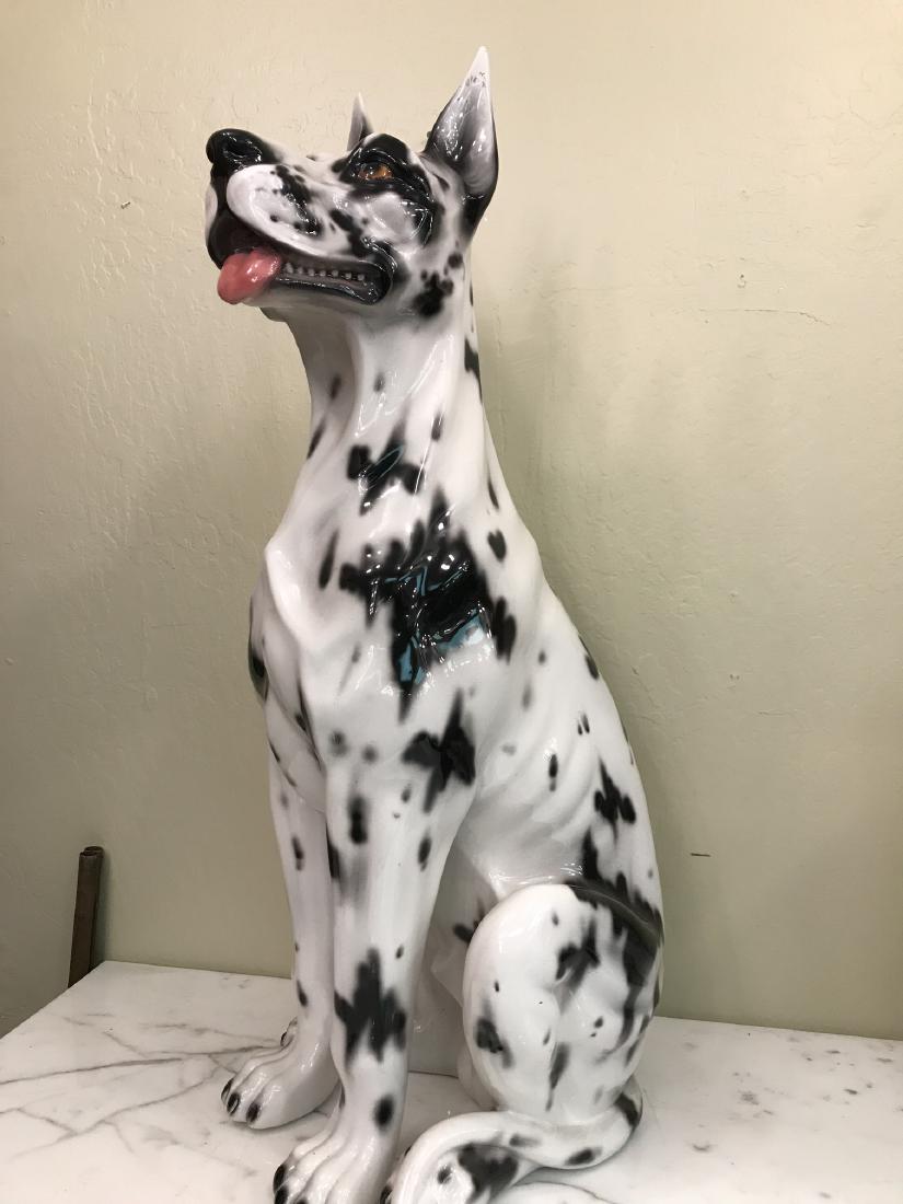 Capodimonte Large Dog Statue: Large porcelain Capodimonte statue of a dog white with black spots. Made in Italy, marked on bottom. From a local estate. In good condition. Measures approx. 34"H x 14"W x 14"D.