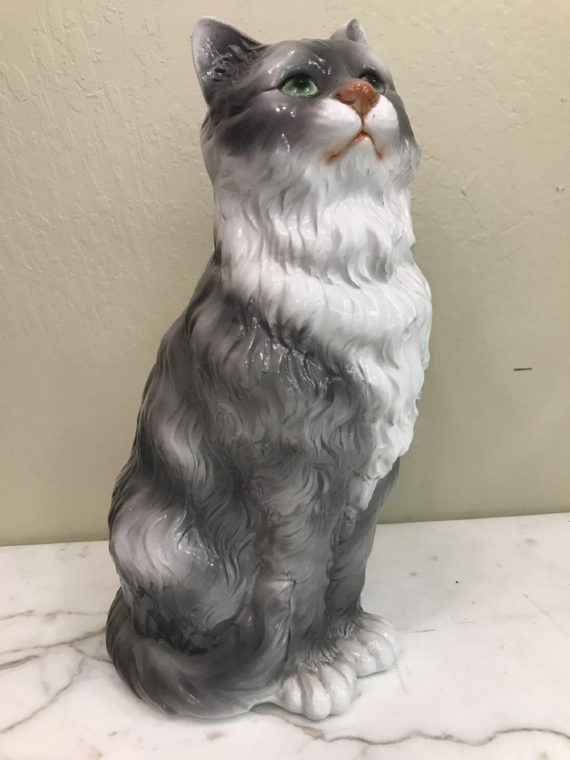 Capodimonte Gray and White Cat Statue: Porcelain Capodimonte statue of a gray and white cat, sitting. Made in Italy. In good condition, from a local estate. Measures approx. 18"H x 9"W x 9"D.