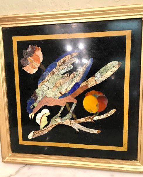 Pietra Dura Mosaic Art w/ Bird, Fruit on a Branch: Pietra Dura mosaic plaque depicting a bird on a branch with fruit. Designed with a variety of inlaid stones set in onyx including carnelian, lapis, agate, and jade. Framed in a wooden gilded frame mea