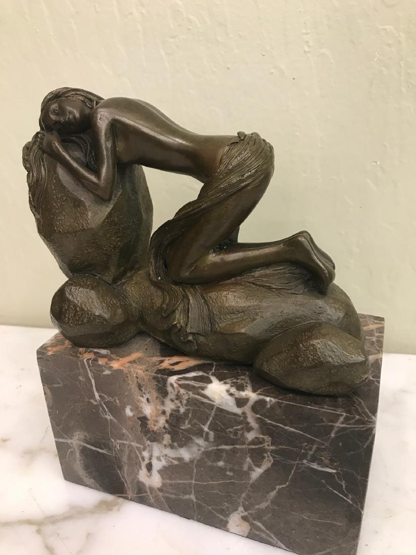 Erotic Bronze Statue of Woman Kneeling: Erotic bronze statue of a woman kneeling on a rock and resting head on a rock. Mounted on a solid marble base. Has good details. In good condition. Measures approx. 7.75"H x 6"W x 3"D.