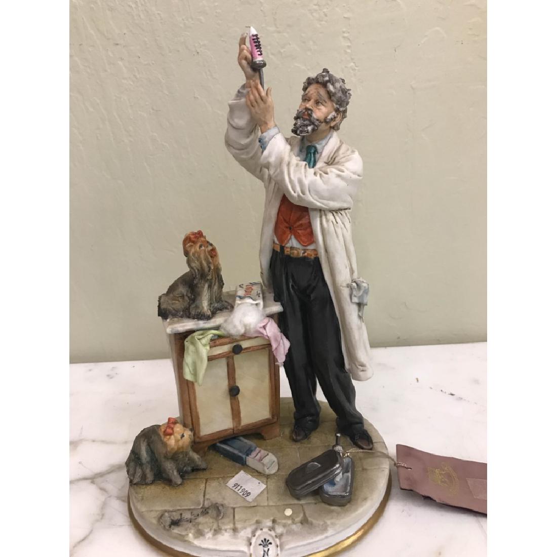 Capodimonte Porcelain Statue of Veterinarian with Dog: Capodimonte Veterinarian with Dog excellent detail , good condition, 12 H x 8 W x 6 D